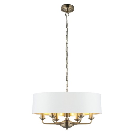 Lampa wisząca Flamenco gold na zdjęciu z zapalonym światłem